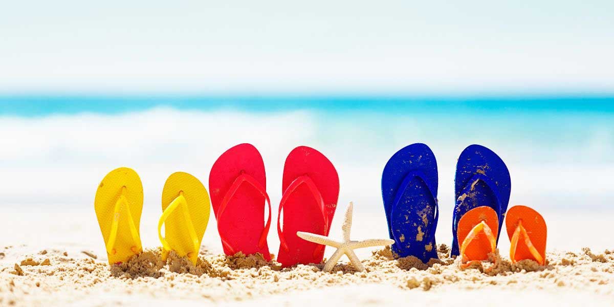 Family Beach Day Flipflops in Sand Photo